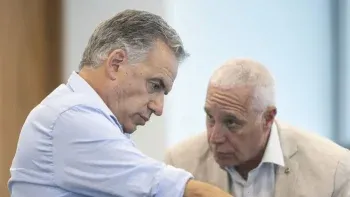 El presidente Orsi y el ministro Negro.